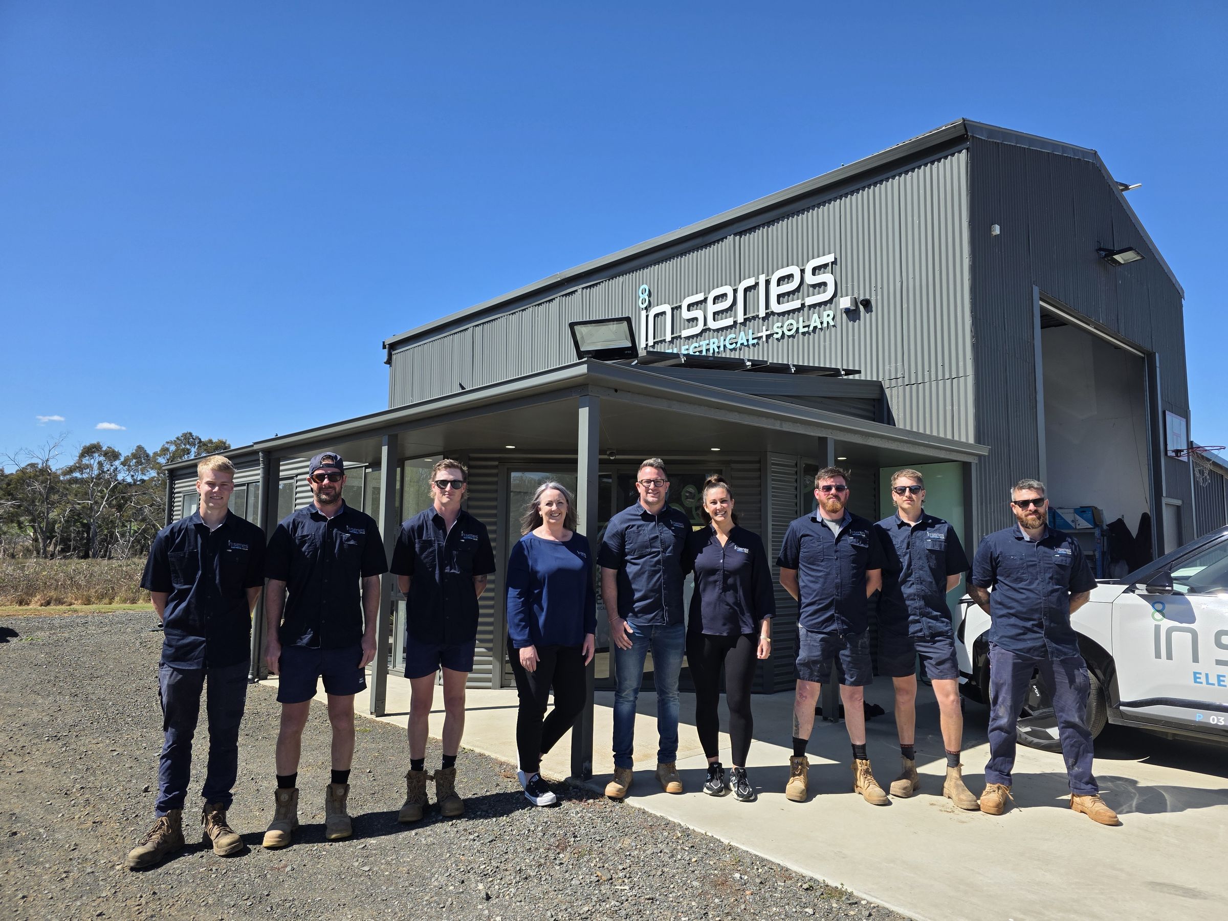 The full In Series Electrical + Solar team standing outside their Launceston workshop